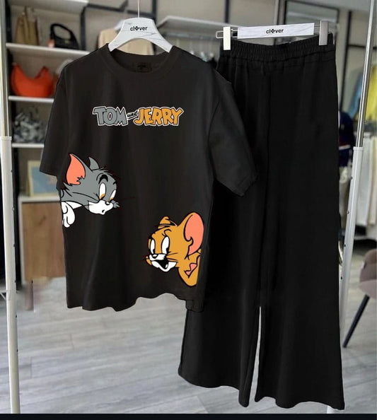 Black t-shirt with Tom and Jerry design and black pants on a hanger.